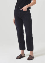 Load image into Gallery viewer, Agolde's best-selling 90's Jean with the much-requested cropped inseam. This decade inspired mid-rise is designed to sit relaxed at the waist with an easy fit through the hips into a classic, loose straight leg. Style back to anything and everything. Available at aprilmae - a womenswear boutique located in Chiswick west London specialising in contemporary, everyday clothing for women. Visit our shop on Devonshire Road W4 for the latest arrivals from brands including Rains, Rails, Bellerose, and Bonte.