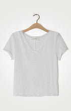 Load image into Gallery viewer, The Sonoma white V-neck T-shirt from American Vintage looks great on its own or layered. It is made from a heavyweight authentic slub cotton and is soft and warm. Featuring raw edge detailing, the Sonoma has a laid-back vibe. Available at aprilmae - a womenswear boutique located in Chiswick west London specialising in contemporary, everyday clothing for women. Visit our shop on Devonshire Road W4 for the latest arrivals from brands including Rains, Rails, Bellerose, Bonte, Vanessa Bruno and Hartford.
