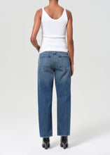 Load image into Gallery viewer, Agolde&#39;s best-selling 90&#39;s Jean in medium vintage indigo with subtle fading, marbling, and whiskering details. This decade inspired mid-rise is designed to sit relaxed at the waist with an easy fit through the hips into a classic, loose straight leg. Style back to anything and everything. Available at aprilmae - a womenswear boutique located in Chiswick west London specialising in contemporary, everyday clothing for women.  Visit our shop on Devonshire Road W4 for the latest arrivals.
