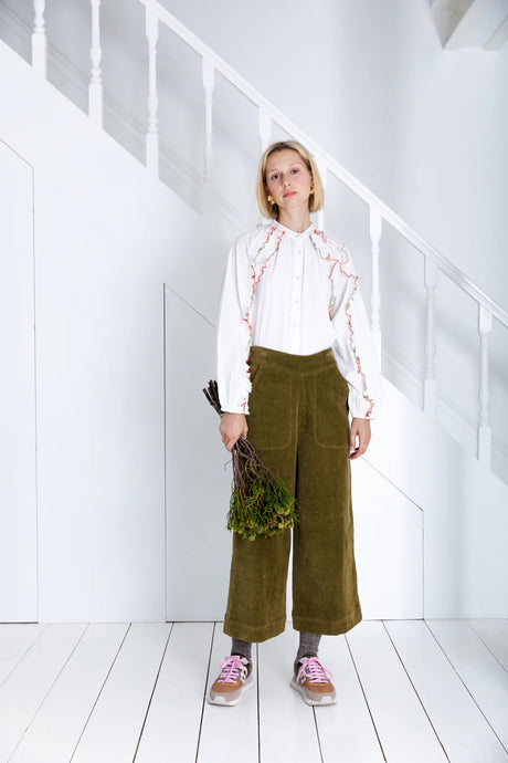 Bijou by Bonte is a loose + relaxed fitting, 3/4 length, wide-leg pull-on trouser, with an elasticated back, in a garment washed organic cotton bay-cord, in a versatile olive green. Side seam pockets with stitch-through detail. Twin-needle stitching throughout. Available at aprilmae - a womenswear boutique located in Chiswick west London specialising in contemporary, everyday clothing for women.  Visit our shop on Devonshire Road W4 for the latest arrivals from brands including Rains, Rails and Bellerose.
