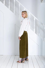 Load image into Gallery viewer, Bijou by Bonte is a loose + relaxed fitting, 3/4 length, wide-leg pull-on trouser, with an elasticated back, in a garment washed organic cotton bay-cord, in a versatile olive green. Side seam pockets with stitch-through detail. Twin-needle stitching throughout. Available at aprilmae - a womenswear boutique located in Chiswick west London specialising in contemporary, everyday clothing for women.  Visit our shop on Devonshire Road W4 for the latest arrivals from brands including Rains, Rails and Bellerose.
