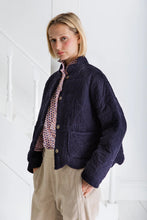 Load image into Gallery viewer, Dillis by Bonte  is a versatile + softly utility inspired quilted jacket, slightly cropped with a feminine scallop detail at the neck and hem.Made in organic cotton baby cord + a printed lining, with a button front detail with mock-horn buttons and two patch pockets. Available at aprilmae - a womenswear boutique located in Chiswick west London specialising in contemporary, everyday clothing for women.  Visit our shop on Devonshire Road W4 for the latest arrivals from brands including Rains, Rails, Bellerose
