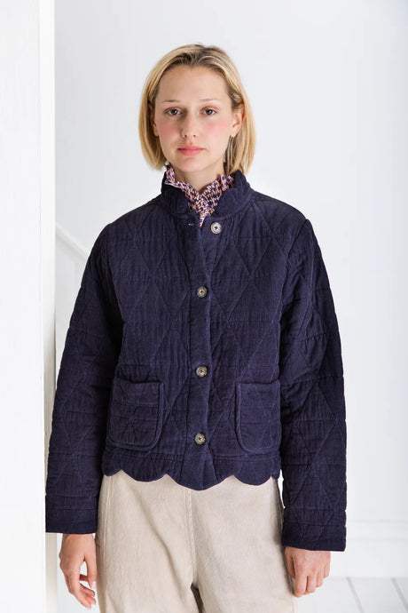 Dillis by Bonte  is a versatile + softly utility inspired quilted jacket, slightly cropped with a feminine scallop detail at the neck and hem.Made in organic cotton baby cord + a printed lining, with a button front detail with mock-horn buttons and two patch pockets. Available at aprilmae - a womenswear boutique located in Chiswick west London specialising in contemporary, everyday clothing for women.  Visit our shop on Devonshire Road W4 for the latest arrivals from brands including Rains, Rails, Bellerose