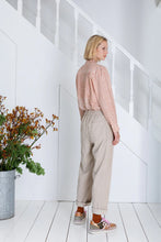Load image into Gallery viewer, The Nova barrel leg jean by Bonte is a relaxed pull-on with an elasticated back, in an organic cotton baby-cord in a versatile ecru, with twin-needle detail . There is a side-seam panel detail with a welt pocket and one back patch pocket. This style works well both rolled up or down. Available at aprilmae - a womenswear boutique located in Chiswick west London specialising in contemporary, everyday clothing for women.  Visit our shop on Devonshire Road W4 for the latest arrivals from all our brands.
