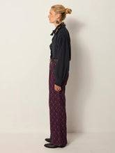 Load image into Gallery viewer, Celeste by Maison Hotel  is a soft viscose shirt with texture and lightness. The blue tone softens into a lived-in wash.  Ruffles trim the collar, placket, and cuffs, adding movement and a romantic edge. The relaxed fit makes it endlessly wearable.  Available at aprilmae - a womenswear boutique located in Chiswick west London specialising in contemporary, everyday clothing for women.  Visit our shop on Devonshire Road W4 for the latest arrivals from brands including Rains, Rails, Bellerose and Bonte.
