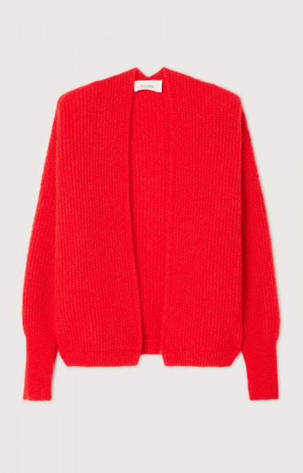 Red sweater on a light gray background. This relaxed edge to edge cardigan from American Vintage is a great go to knit to throw over a T-shirt or shirt. It is made from a lightweight and warm Italian yarn blend. Available at aprilmae - a womenswear boutique located in Chiswick west London specialising in contemporary, everyday clothing for women.  Visit our shop on Devonshire Road W4 for the latest arrivals from brands including Rains, Rails, Bellerose, Bonte, Vanessa Bruno, Hartford and Colorful Standard.