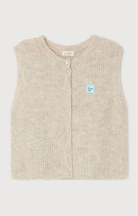 A sleeveless beige cardigan from American Vintage with a round neckline and button closures at the front. East Sleeveless Cardigan - Powder. Available at aprilmae - a womenswear boutique located in Chiswick west London specialising in contemporary, everyday clothing for women.  Visit our shop on Devonshire Road W4 for the latest arrivals from brands including Rains, Rails, Bellerose, Bonte, Vanessa Bruno, Hartford and Colorful Standard.
