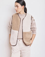 Load image into Gallery viewer, Hartford sleeveless women&#39;s vest in curly faux-fur patchwork. No buttons. Exclusive leopard print lining. Contrasting bias trim. Available at aprilmae - a womenswear boutique located in Chiswick west London specialising in contemporary, everyday clothing for women.  Visit our shop on Devonshire Road W4 for the latest arrivals from brands including Rains, Rails, Bellerose, Bonte, Vanessa Bruno and Colorful Standard.
