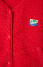 Load image into Gallery viewer, A red fleece gilet with snap button closure, zip pockets, and an American Vintage patch logo on the left chest area. Hoktown hooded fleece by American Vintage in strawberry red. Available at aprilmae - a womenswear boutique located in Chiswick west London specialising in contemporary, everyday clothing for women.  Visit our shop on Devonshire Road W4 for the latest arrivals.
