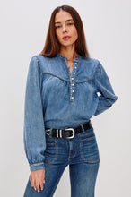 Load image into Gallery viewer, Woman wearing a blue denim blouse and jeans on a white background nRails Sunna top denim blue aprilmae London chiswick
