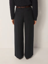 Load image into Gallery viewer, Designed with a straight leg, high waist and front pleats, the Keaton Pants by Maison Hotel in Blue bridge sharp tailoring with everyday ease. Available at aprilmae - a womenswear boutique located in Chiswick west London specialising in contemporary, everyday clothing for women.  Visit our shop on Devonshire Road W4 for the latest arrivals from brands including Rains, Rails, Bellerose, Bonte, Vanessa Bruno, Hartford and Colorful Standard.
