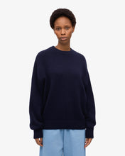 Load image into Gallery viewer, Colourful Standard Women&#39;s Merino Wool Oversized Crew in Navy Blue the epitome of cozy sophistication. Crafted from premium recycled merino wool, this oversized crewneck sweater offers unparalleled softness, breathability, and temperature regulation for year-round comfort.Available at aprilmae - a womenswear boutique located in Chiswick west London specialising in contemporary, everyday clothing for women.  Visit our shop on Devonshire Road W4 for the latest arrivals.
