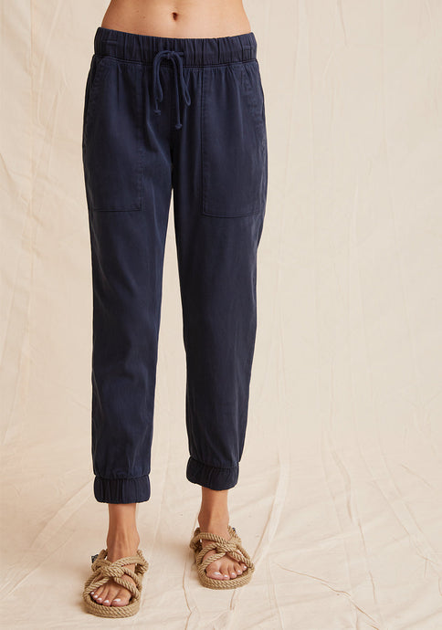 The Pocket Jogger from Bella Dahl is a new forever favourite. It has a relaxed feel to it and features a drawstring waist, large front pockets and elasticised cuffs. Shown in Endless Sea a dark blue. Available at aprilmae - a womenswear boutique located in Chiswick west London specialising in contemporary, everyday clothing for women.  Visit our shop on Devonshire Road W4 for the latest arrivals from brands including Rains, Rails, Bellerose, Bonte, Vanessa Bruno, Hartford and Colorful Standard.